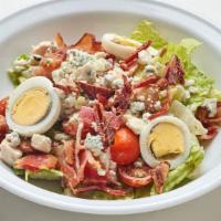 Cobb Salad · With chicken breast, bacon, avocado, blue cheese, tomatoes, eggs and ranch dressing (Contain...