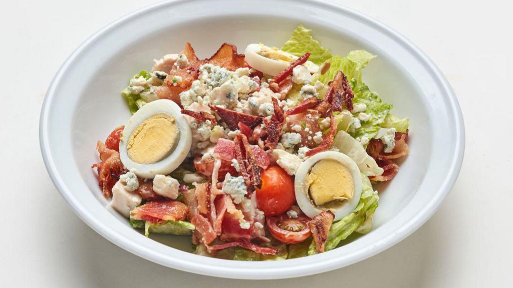 Cobb Salad · With chicken breast, bacon, avocado, blue cheese, tomatoes, eggs and ranch dressing (Contains eggs, dairy)