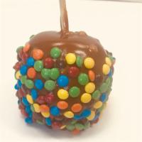 Caramel Apple w/ M&M · Large Granny Smith green apple dipped in rich, butter homemade caramel and rolled with color...