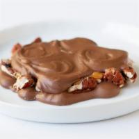 Pecan Caramel Turtle · Layer of rich buttery caramel, on whole pecan and cover with smooth chocolate.  Take bite of...