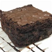 Chocolate Brownie · Large thick square of  Homemade chocolate brownie with dark chocolate chip.