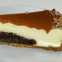 Pecan caramel turtle cheesecake · Cheesecake topped with caramel and pecan.