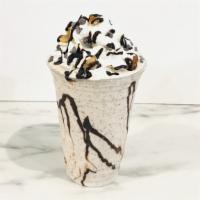 Chunky Monkey · Vanilla ice cream blend with fresh banana, walnuts and chocolate chips. Topped with whipped ...