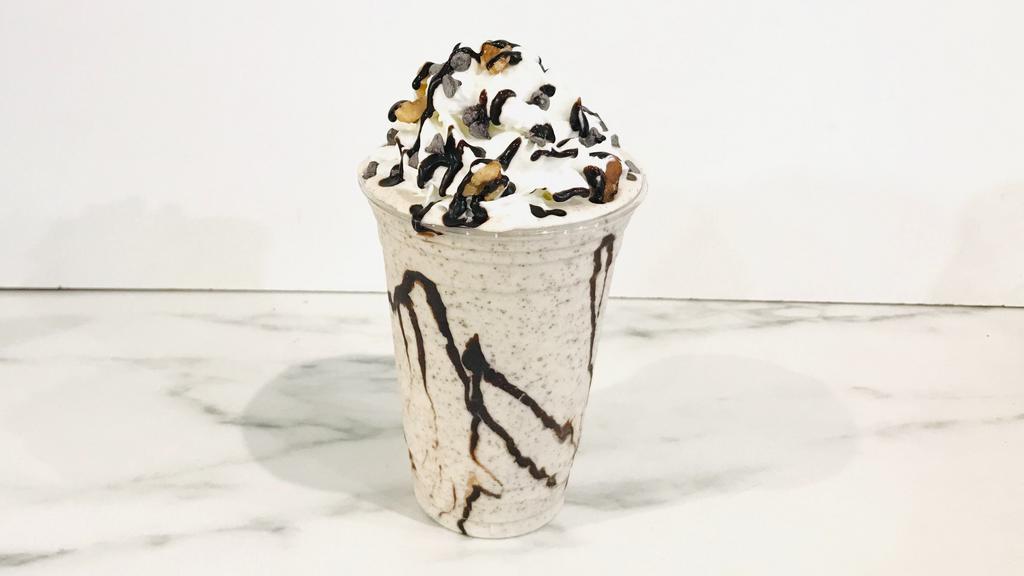 Chunky Monkey · Vanilla ice cream blend with fresh banana, walnuts and chocolate chips. Topped with whipped cream.