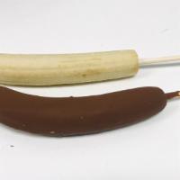 Chocolate dipped Frozen Banana · Just Perfectly ripen banana,  frozen and dipped in chocolate.