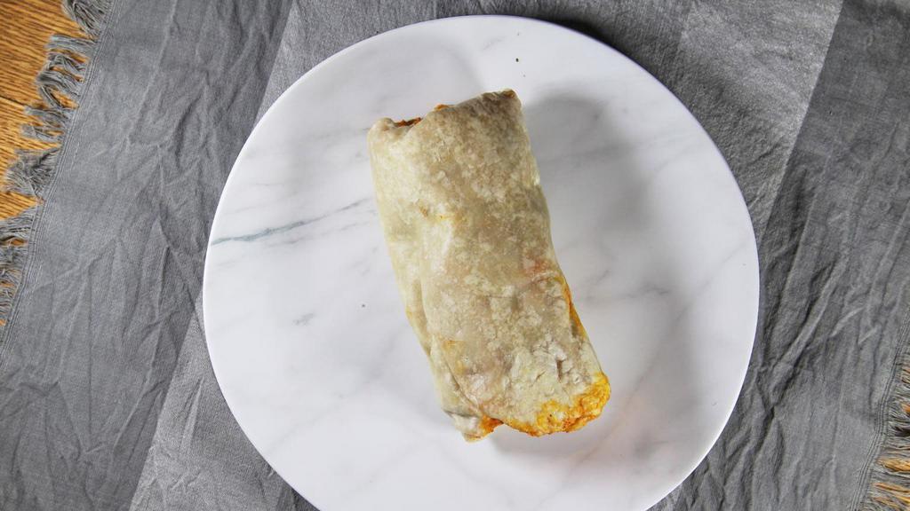 Super Burrito de Carnitas · Super Burrito with cilantro, cebolla, rice, whole beans, lechuga, queso, y crema