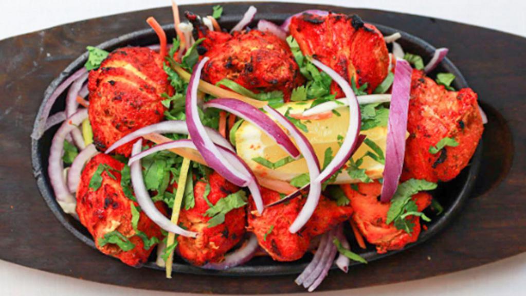 Punjabi Chicken Tikka Kebab-Premium · Boneless chicken marinated in yogurt, roasted whole spices, jalapeños, ginger, garlic.