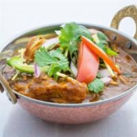 Nepali herbs Chicken Curry · Chicken cooked in tomato and onion sauce with Himalayan spices.