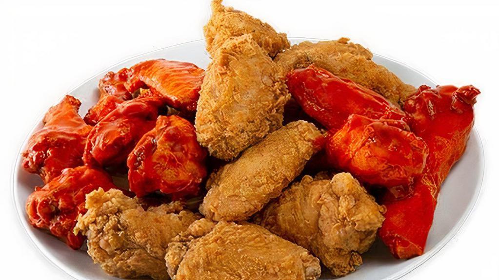 Traditional Wings · Traditional or tossed in our buffalo or sweet & sour sauces, these wings are fried and seasoned to perfection! Comes in 5 piece, 10 piece, 20 piece, and 40 piece choice.