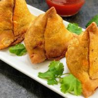 SAMOSA(2 NOS)* · Deep fried pastry with a savory filling, such as spiced potatoes, onions and peas triangular...