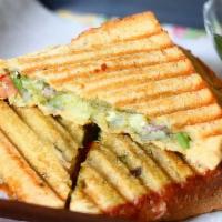 MUMBAI SANDWICH* · Popular sandwich topped with a vibrant herb chutney, cheese, chaat masala and layers of cucu...