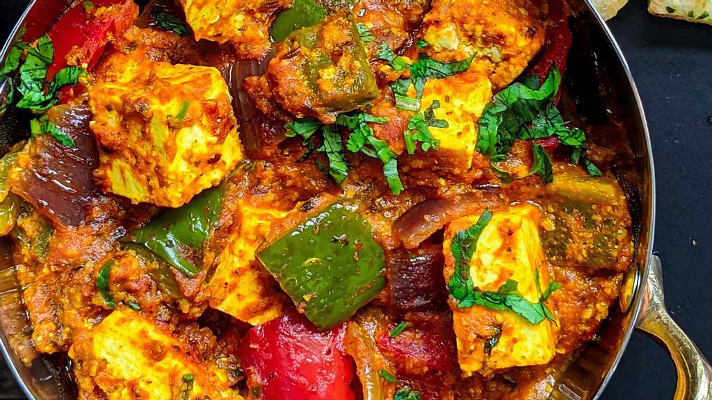 KADAI PANEER (12oz)* · Vibrant, tangy, spiced indian cottage cheese (paneer) cooked in onion tomato gravy made with the usual Indian pantry staples like onions, tomatoes, bell peppers, herbs and spices.