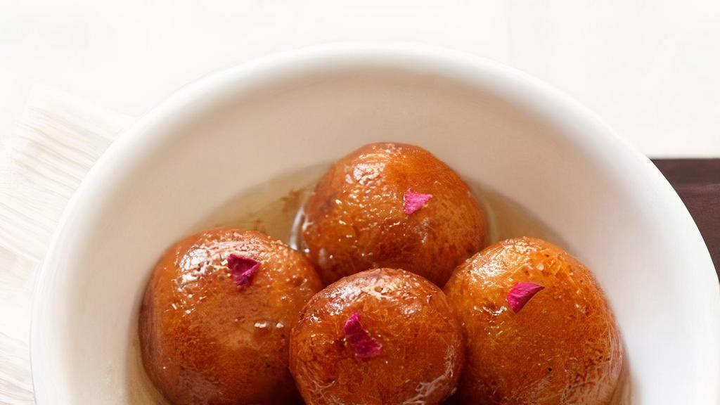 GULAB JAMUN(3 PCS)* · Three pieces of sweet milky soft dough balls soaked in rose flavored sugar syrup. Essentially, deep fried balls made of milk powder, flour, butter and milk, and then soaked in saffron and rose flavored sugar syrup.