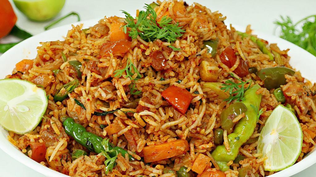 TAWA PULAO + RAITHA · Tawa Pulao is popular street food in Mumbai that consists of rice and vegetables sautéed together with pav bhaji masala, herbs, and spices.