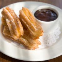 Churros with Ibarra Chocolate · Argentinean doughnuts served with . ibarra chocolate dipping sauce
