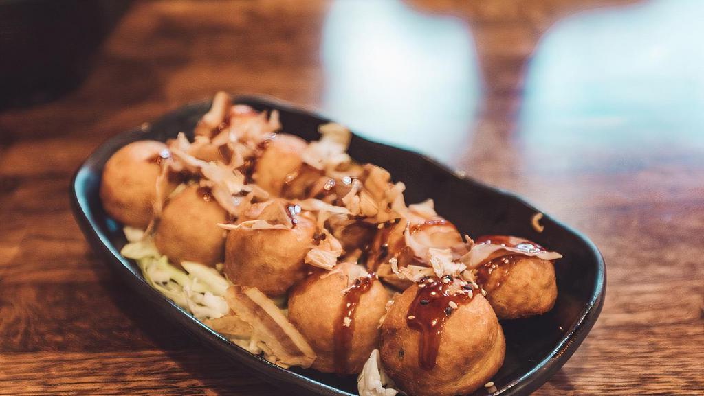 Takoyaki (8pc) · Little leg of octopus, battered and fried into a ball, sauced, and topped with bonito flakes (fish flakes).