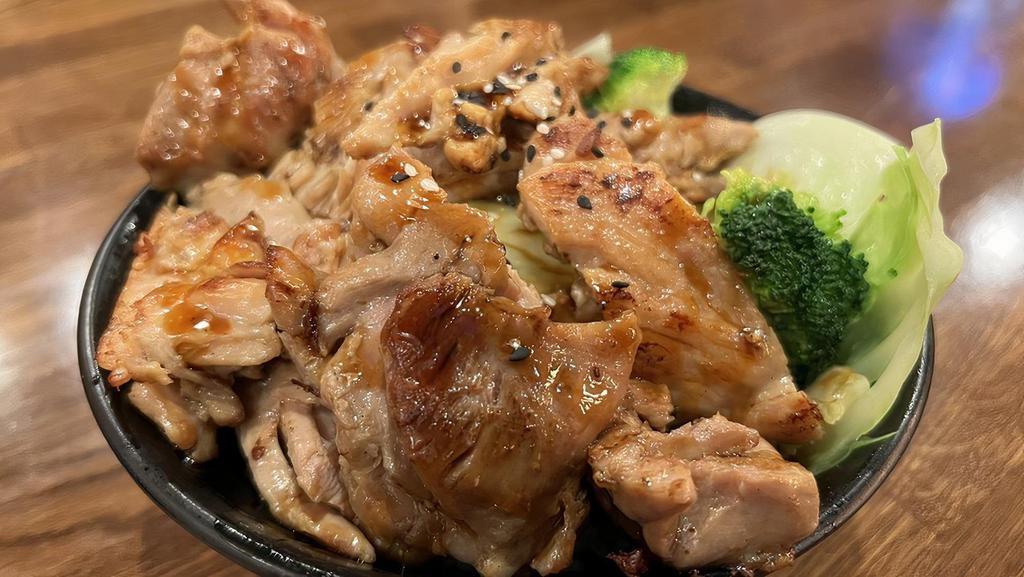 Chicken Rice · Grilled chicken, cabbage and broccoli on rice with teriyaki sauce drizzle and sesame seeds.