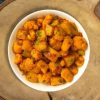 Aloo Gobi Show Me · Fresh cauliflower with sauteed potatoes, stir fried with house spices. Vegan.