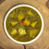 Saag aloo loo land · Slow-cooked spinach and mustard greens with fresh ginger, aloo and garlic. Vegan.