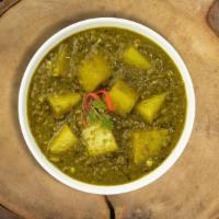 Show Me Saag Aloo Dinner · Slow cooked spinach and mustard greens with fresh ginger, aloo and garlic. Vegan. Comes with...