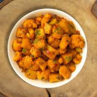 Aloo Gobi Desert Dinner · Fresh cauliflower with sauteed potatoes, stir fried with house spices. Vegan. Comes with ric...