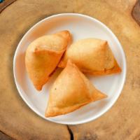 Samosa Leviosa  · 2 pieces. Fried pastry shells, cumin potatoes, served with garbanzo beans cholay and chutney...