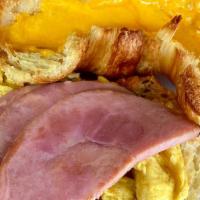 The Block Buster Breakfast Sammy · Scrambled eggs, melted cheddar and choice of bacon or ham on a flaky croissant. good morning!