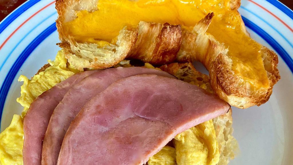 The Block Buster Breakfast Sammy · Scrambled eggs, melted cheddar and choice of bacon or ham on a flaky croissant. good morning!