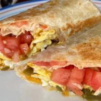 The  Daymaker  · Scrambled eggs, sausage, onion, tomato, minced jalapeño and cheddar wrapped  in a corn torti...