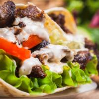 Beef & Lamb Gyro · A Seasoned beef and lamb mix, cooked on a
vertical rotisserie served on a warm lavash
bread ...