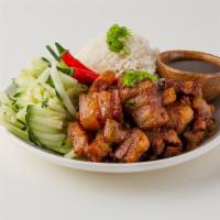 Caramelized Pork Belly Bowl · Steamed white rice with a serving of braised vietnamese porkbelly and a side of veggies.