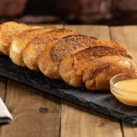 Cinnamon Bread Sticks · Butter toasted and sliced french baguettes dusted in sweet cinnamon