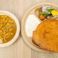 Chole Bhature · Garbanzo beans made in special blend of spices with two bhature.