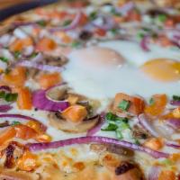 Huevos Rancheros · Black beans, jalapenos, red onions, cheese, egg, finished with sour cream and cilantro.