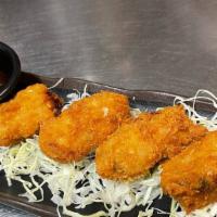 Fried Oysters (4) · Panko-fried oysters served with katsu sauce.
