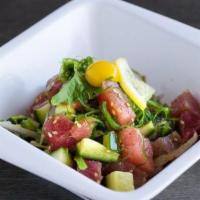 Poke Salad · Diced tuna with wakame, kaiware sprouts, red onions, furikake, cucumber, and sesame oil.