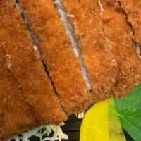 Tonkatsu · Panko-fried pork cutlet served with katsu sauce and served with cabbage salad.