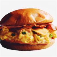 Egg, Bacon & Cheese B*tches Breakfast Sandwich · An egg sandwich with two eggs scrambled, crispy bacon, melted cheddar cheese and a spicy fry...