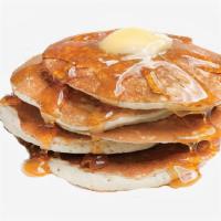 Classic B*tches Pancakes · Two fluffy pancakes served with a side of butter and syrup.