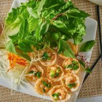 A5. Banh Khot · Crispy shrimp cupcakes with mixed greens served with fish sauce.