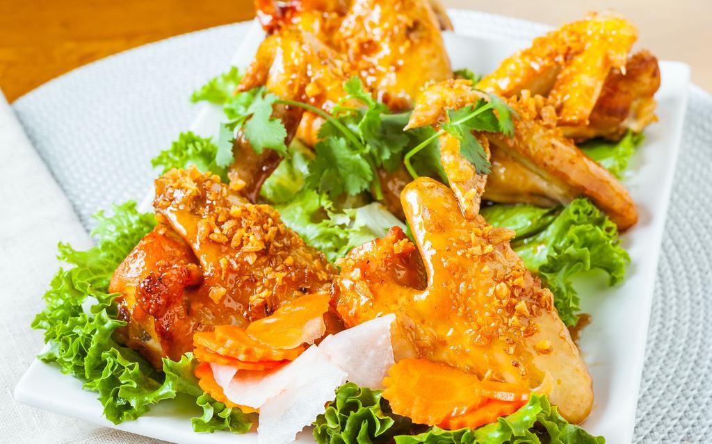 A8. Canh Ga Chien Nuoc Mam · Deep-fried chicken wings in fish sauce.