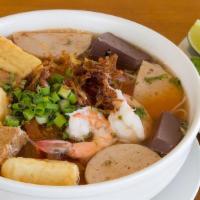 21. Bun Rieu · Vermicelli noodle with crab paste broth, pork blood, Vietnamese ham, ground pork, shrimp, to...