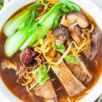 19. Mi Vit Tiem · Egg noodle soup with duck leg, shiitake mushrooms, and baby choy vegetables.