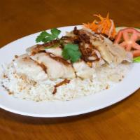 38. Com Ga Hai Nam · Hainan steamed chicken over rice, served with house ginger sauce.