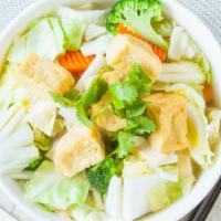 V4. Pho Chay · Vegetarian rice noodle soup served with mixed vegetables tofu, and mushrooms.