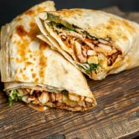 The Chicken Burrito · Massive 13.5 inch flour tortilla stuffed with tender, marinated shredded chicken and our hou...