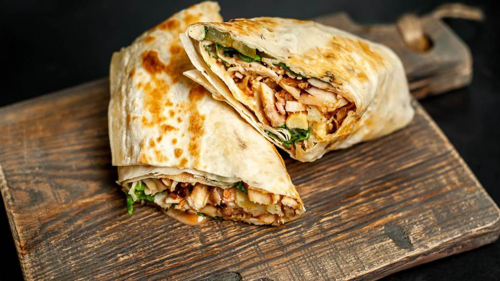 Regular Pollo Asado / Roasted Chicken Burrito · Hot & Tasty Burrito prepared with Roasted Chicken, beans, rice, cheese, lettuce, salsa, sour cream, avocados, and jalapeño. Served in customer's preference of Tortilla.