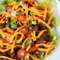Crispy Steak Taco Salad · Delicious crispy taco salad prepared with grilled steak strips and fresh romaine lettuce top...