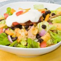 Crispy Chicken Taco Salad · Delicious crispy taco salad prepared with grilled chicken and fresh romaine lettuce topped w...