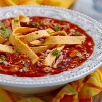 Tortilla Soup · Hot & Tasty Soup filled with Marinated grilled chicken, fresh avocado, cheese and tortillas ...
